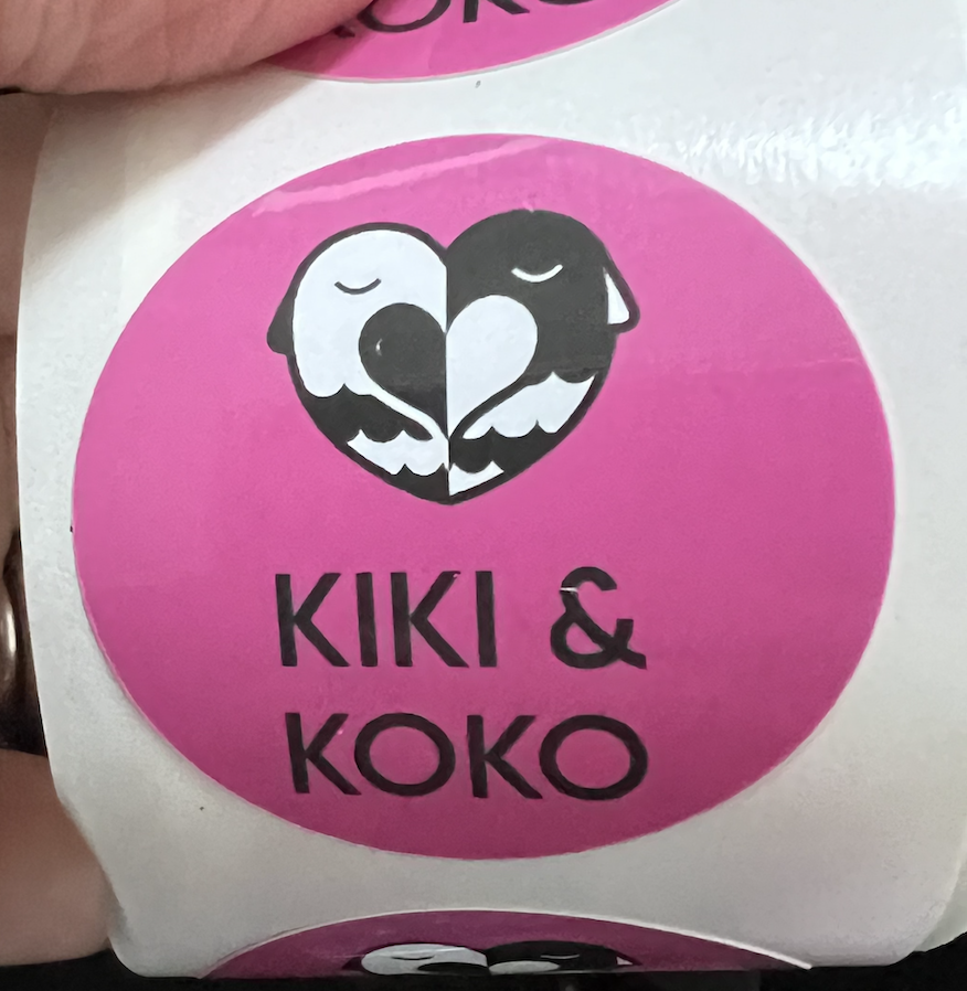 a sheet of pink stickers with the Kiki & Koko logo on it