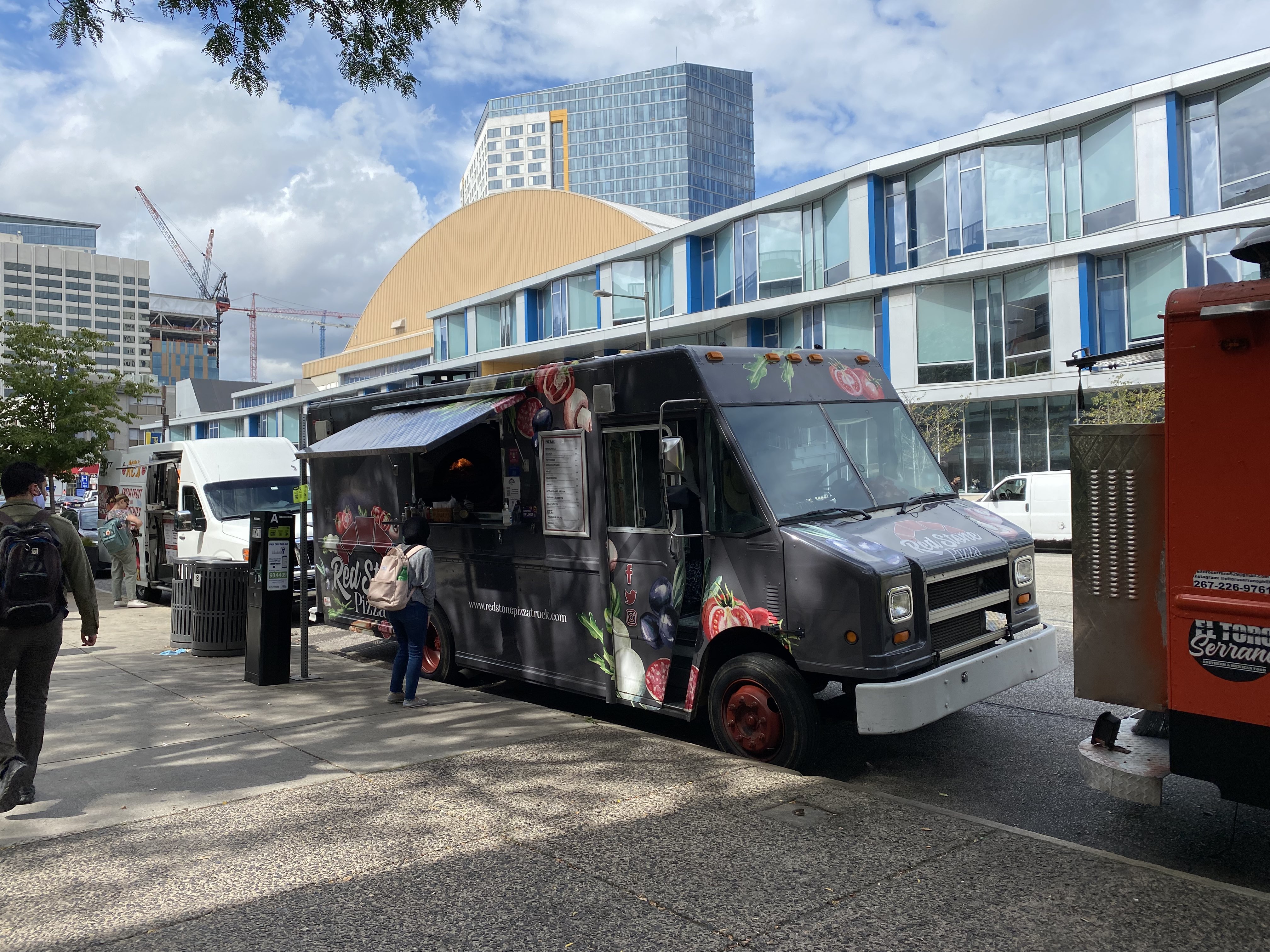 foodtruck parked next to the sidewalk